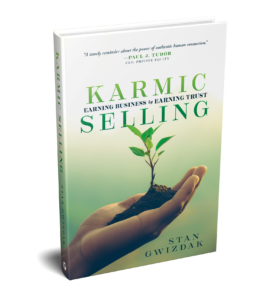 Karmic Selling front cover: contains an image of a hand holding dirt and a growing sprout